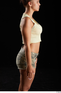 Jennifer Mendez 1 arm casual dressed flexing side view tank…
